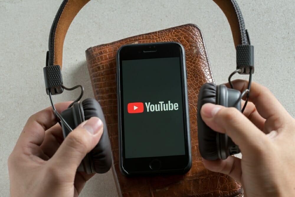 youtube on phone with headphones
